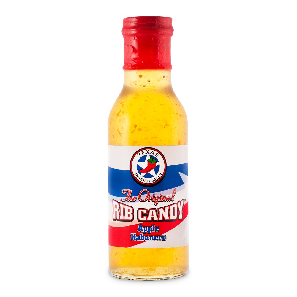 Bottle  of Texas Pepper Jelly Apple Habanero Rib Candy, with a label showing apples and habanero peppers. The sauce is designed to glaze meats such as ribs, chicken wings, and pork loin, adding a glossy finish and a blend of sweet and spicy flavors.