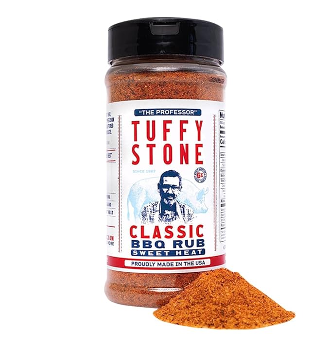 A bottle of Tuffy Stone Classic BBQ Rub Sweet Heat seasoning with the label visible, showing the brand name, a picture of Tuffy Stone, and the product description. A small pile of the seasoning is placed in front of the bottle.